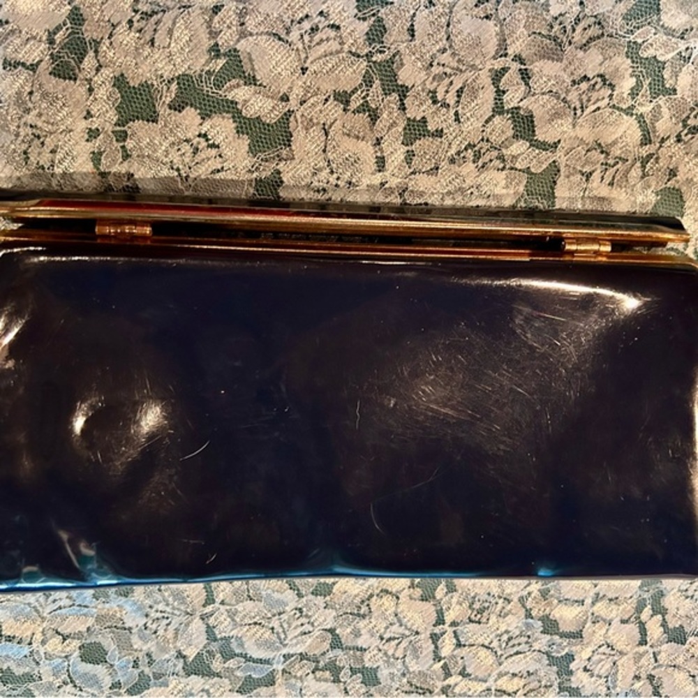 Vintage navy blue vinyl clutch with gold clasp and GORGEOUS lining!
